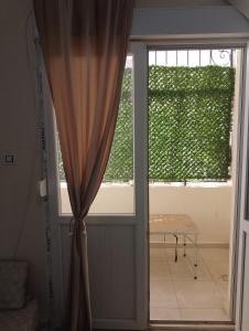 a door leading to a room with a window at MDN location in Alger