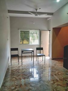a room with two chairs and a table and a window at The Happy Homestay in Nāmkom