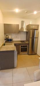 Η κουζίνα ή μικρή κουζίνα στο Comfy luxury Homes