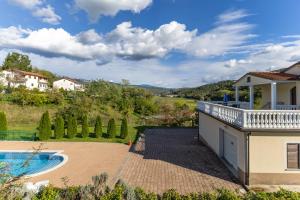 an estate with a swimming pool and a house at Maria Buzet 1 with Shared Pool in Buzet