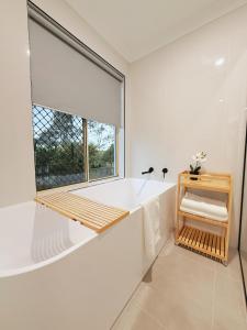 Φωτογραφία από το άλμπουμ του Family & Pet-Friendly 4BR Home Freshly Renovated near Transport & Malls σε Kuraby