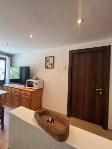 a living room with a dog bed on the floor at Maen apartment, Valtournenche in Valtournenche