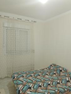 Ένα ή περισσότερα κρεβάτια σε δωμάτιο στο Draria chemin des crêtes