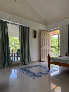 Postel nebo postele na pokoji v ubytování Murthi's Farm House + 7 fotografií