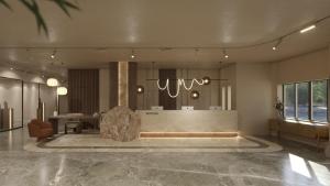 a lobby with a large room with a table at Themis Beach Hotel in Kokkini Khanion