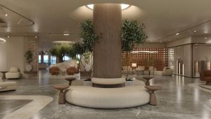 a lobby with a column in the middle of a building at Themis Beach Hotel in Kokkini Khanion +74 photos