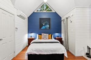 A bed or beds in a room at Two Truffles Cottage Accommodation