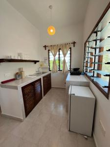 Η κουζίνα ή μικρή κουζίνα στο Arcade Comfort Suite +5 φωτογραφίες