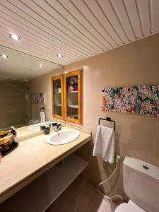 a bathroom with a sink and a toilet and a mirror at Bab El Mina guest house Byblos port jbeil in Jbeil +105 photos