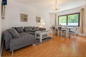 a living room with a couch and a table at Ferienhaus Mellenthin Ferienhaus Mellenthin in Mellenthin