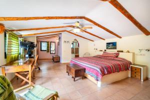 a bedroom with a bed and a desk at El Balcón de la Sierra in Cazorla
