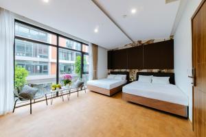 Postel nebo postele na pokoji v ubytování Paradise Bay Hotel - Vinhomes Ocean Park 3