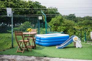 Bassein majutusasutuses Charming OUG Bungalow 6BR Cozy Family Escape plus Baby Cot või selle lähedal