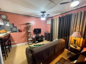 a living room with a couch and a table at Arezzo Place Condominium in Davao City
