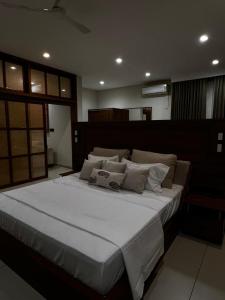 Ένα ή περισσότερα κρεβάτια σε δωμάτιο στο Townsquare Residency