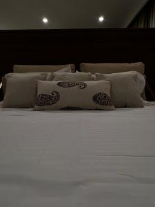 Ένα ή περισσότερα κρεβάτια σε δωμάτιο στο Townsquare Residency