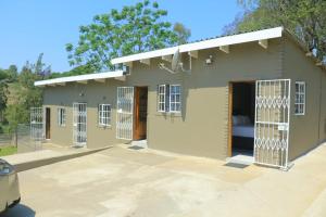 a rendering of a small house with gates at Phola La Bed and Breakfast in Melmoth