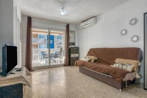 TV a/nebo společenská místnost v ubytování Apartamento en playa de Daimús