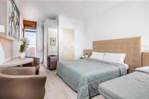 Ένα ή περισσότερα κρεβάτια σε δωμάτιο στο Hotel Palma de Majorca +69 φωτογραφίες