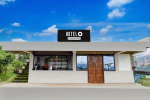 a restaurant with a sign on the front of it at Hotel O Ranka Gangtok in Tādong +22 photos