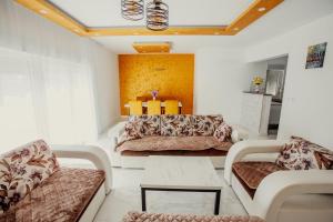 a living room with a couch and a table at Villa Deluxe Buna in Mostar