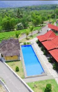 an aerial view of a resort with a swimming pool at Katah Montana Villa in Tonoboyo