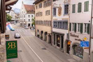 an empty street in a city with buildings at Stylish Apartment in the Heart of Zug by Airhome in Zug