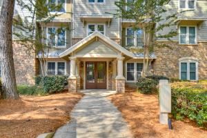 a brick house with a driveway in front of it at Lake Oconee Creekside Condo with Dock Access in Liberty