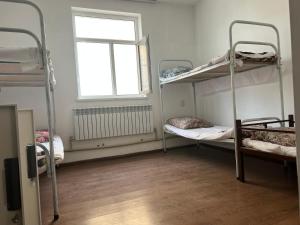 Un ou plusieurs lits dans un hébergement de l'établissement Nomad School Hostel