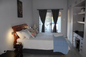 Giường trong phòng chung tại Lion of Judah