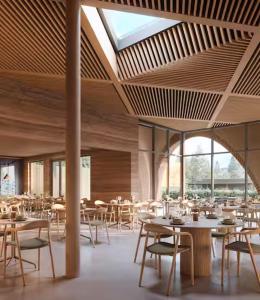 a dining room with tables and chairs and windows at Brún in Laugaras