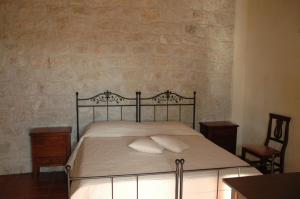 Postel nebo postele na pokoji v ubytování Agriturismo Il Melograno
