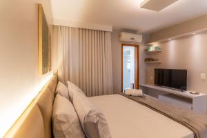 TV a/nebo společenská místnost v ubytování Suíte Luxor Clean By Boss