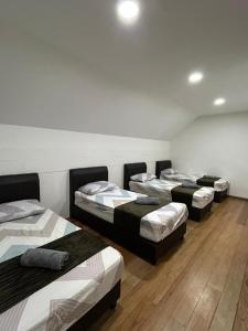 Ένα ή περισσότερα κρεβάτια σε δωμάτιο στο Ella Residence Roomstay