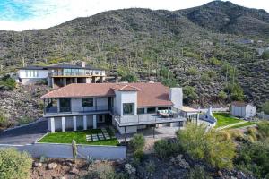 an aerial view of a house with a mountain at Black Mountain Gem! Designer Completely Renovated! in Cave Creek