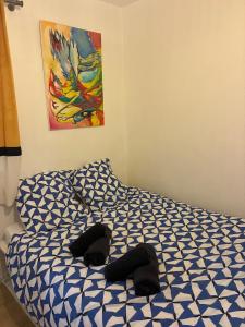 a bed with two pillows on it in a room at Le charmant Jules Julien parking privé in La Celle-sous-Gouzon