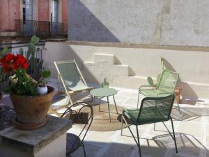 a group of chairs and tables on a patio at Casa Brumar in Nardò