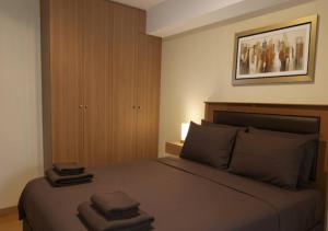 Ένα ή περισσότερα κρεβάτια σε δωμάτιο στο E 24h Urban Comfort 1BR 302