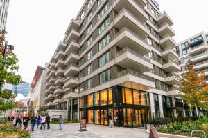 a tall building with people standing outside of it at Blueground Stratford rooftop nr Olympic Park LON-690 in London