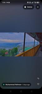 a screenshot of a website with a picture of a building at Al Jannat Nature view Rooms in Murree
