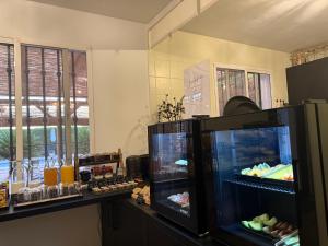 a kitchen with two refrigerators with food in it at Casa de Ámbar, Bed&Breakfast in Alhaurín el Grande