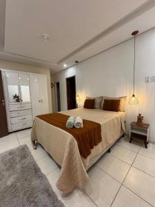 Ένα ή περισσότερα κρεβάτια σε δωμάτιο στο Casa Sossego