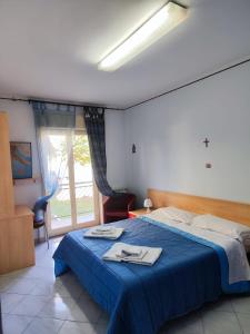 Postel nebo postele na pokoji v ubytování Appartamento Santa Rita