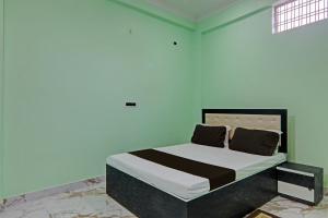 Giường trong phòng chung tại Hotel O WELCOME GUEST HOUSE