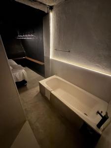 a bathroom with a bath tub in a room at Mirante de itaipava in Itaipava