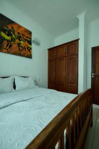 Ένα ή περισσότερα κρεβάτια σε δωμάτιο στο Elles Residence -Sweet & Serene