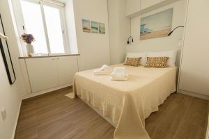 Ένα ή περισσότερα κρεβάτια σε δωμάτιο στο Castle House Tavira