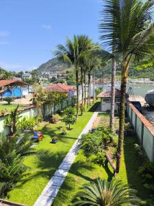 an aerial view of a resort with palm trees at Farol dos Coqueiros in Angra dos Reis