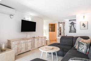 Et tv og/eller underholdning på Moser Living Premium Apartments - Puerto Rico