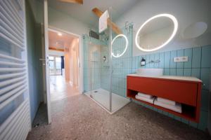 a bathroom with a red sink and a shower at stuub schluchsee in Schluchsee +19 photos